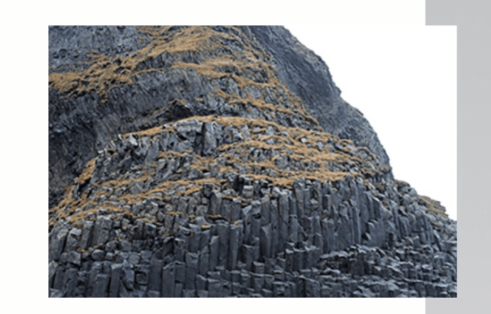 The photograph shows hexagonal basalt columns